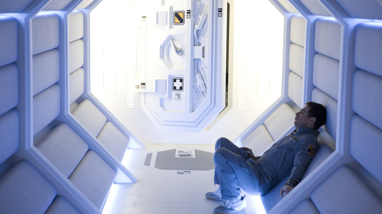 Sam Bell sitting in spaceship