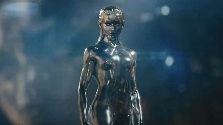 Silver Surfer talking in front of an image of herself in The Fantastic our: First Steps (2025)