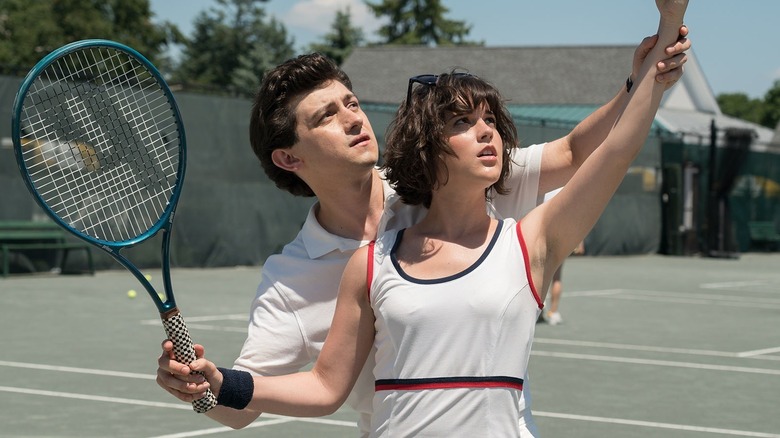 David shows Skye how to serve