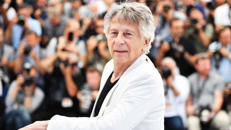 Roman Polanski posing for photo