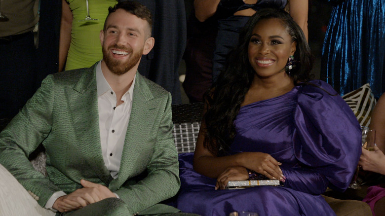 Cameron and Lauren sitting together smiling on Love is Blind (2020)