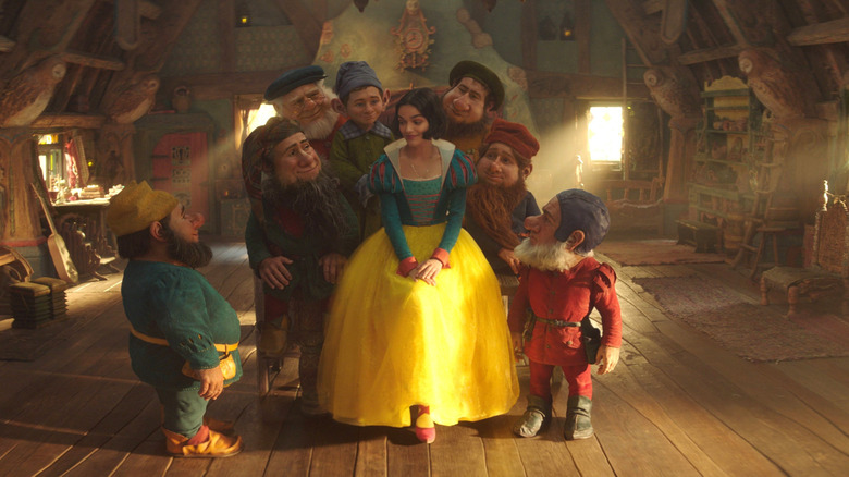 Seven Dwarfs surround Snow White in "Snow White" (2025)