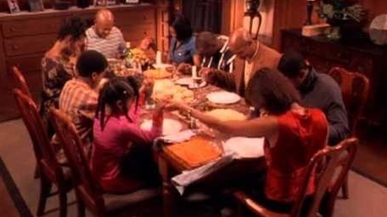 A family prays at the dinner table in "Soul Food" (2000-2004)