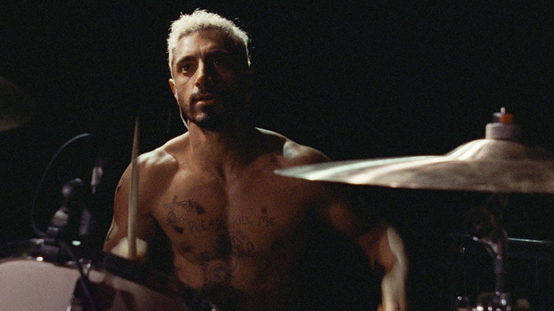 Ruben drumming shirtless in Sound of Metal