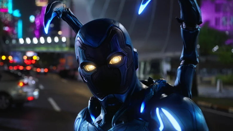 Blue Beetle in the middle of the street in "Blue Beetle" (2023)