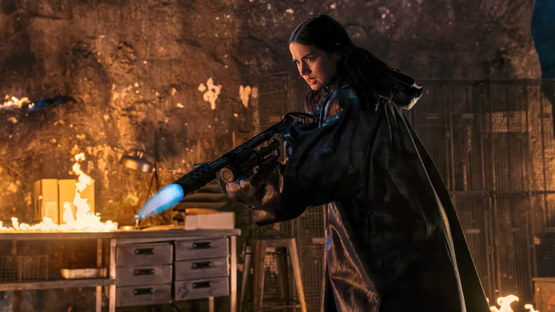 Eve Macarro holding her trusty flamethrower