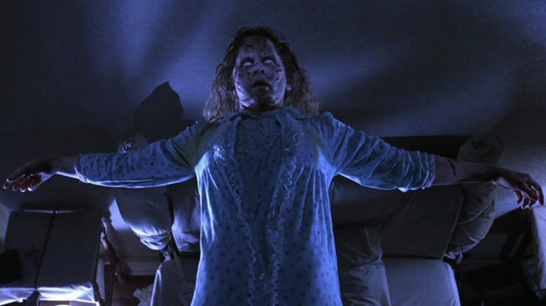 Reagan floats above her bed, arms outstretched, in "The Exorcist" (1973)