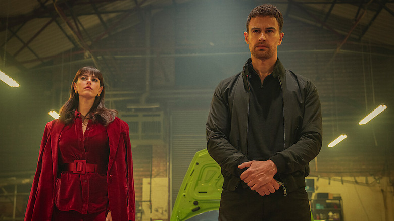 Eddie and Susan stand in a warehouse