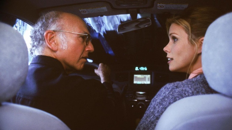 Larry and Cheryl go through a car wash in "The Grand Opening"