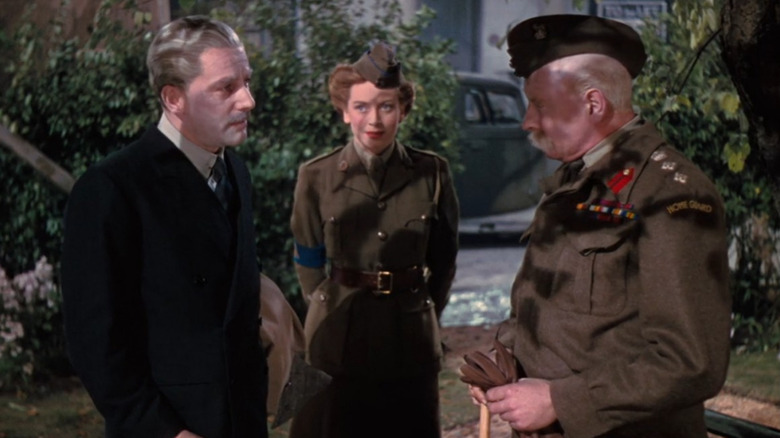 Theo, Angela, and Clive stand together in "The Life and Death of Colonel Blimp" (1945)