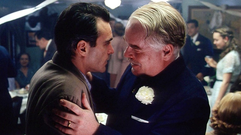 Lancaster holding Freddie by the arms in "The Master" (2012)