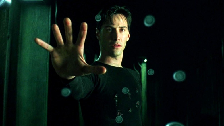 Neo tops bullets in mid air in "The Matrix" (1999)
