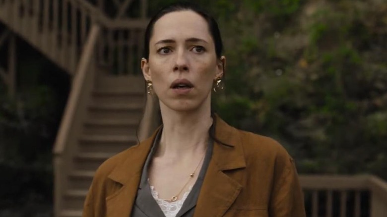 Beth stands shocked in her backyard in "The Night House" (2020)