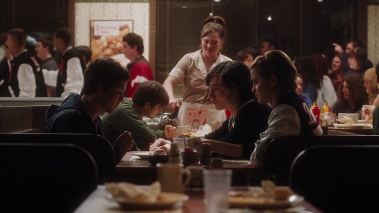 Charlie (Logan Lerman) eating at a diner with new friends Patrick (Ezra Miller) and Sam (Emma Watson)