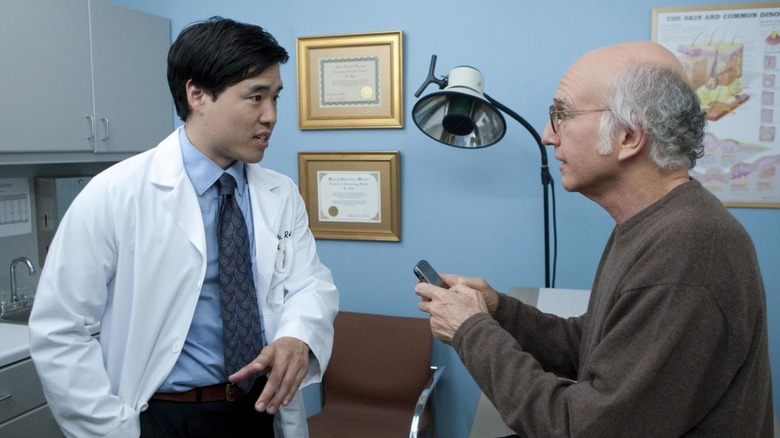 Larry talks to a doctor while texting in "The Table Read"