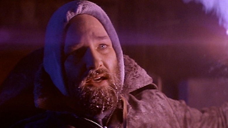 MacReady lights a torch in "The Thing" (1982)