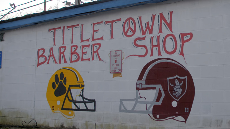 Valdosta GA titletown barber shop mural on baseball dugout
