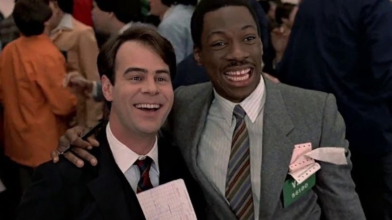 Valentine puts his arm around Winthorpe in Trading Places (1983)