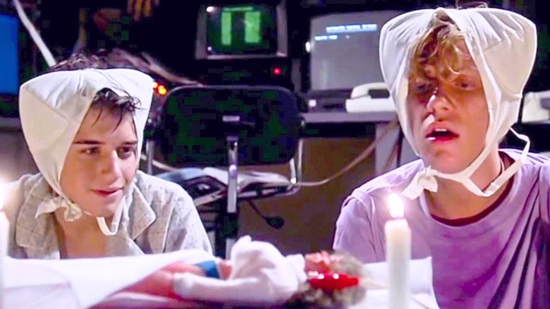 Gary and Wyatt with bras on their heads in "Weird Science"