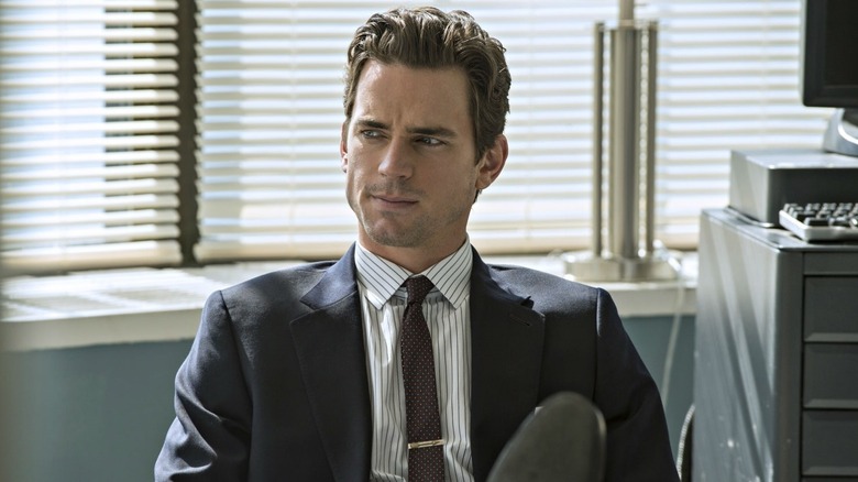 Neal with his feet propped up in "White Collar"