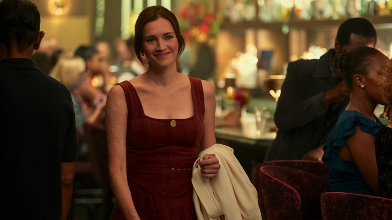 Kate smiling with her scars visible