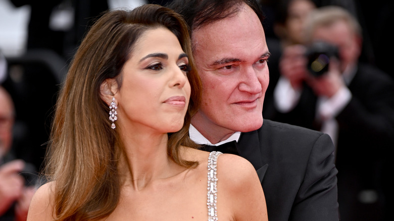 Quentin Tarantino posing with his wife, Daniella