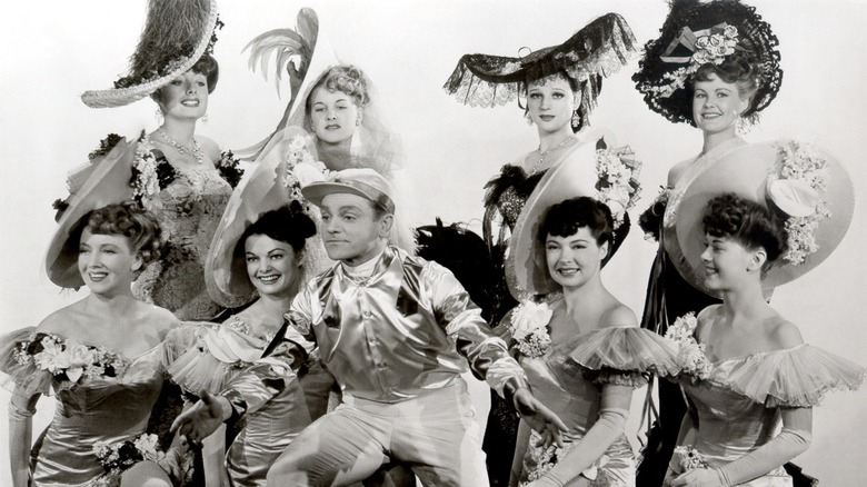 George M. Cohan posing with showgirls in "Yankee Doodle Dandy"