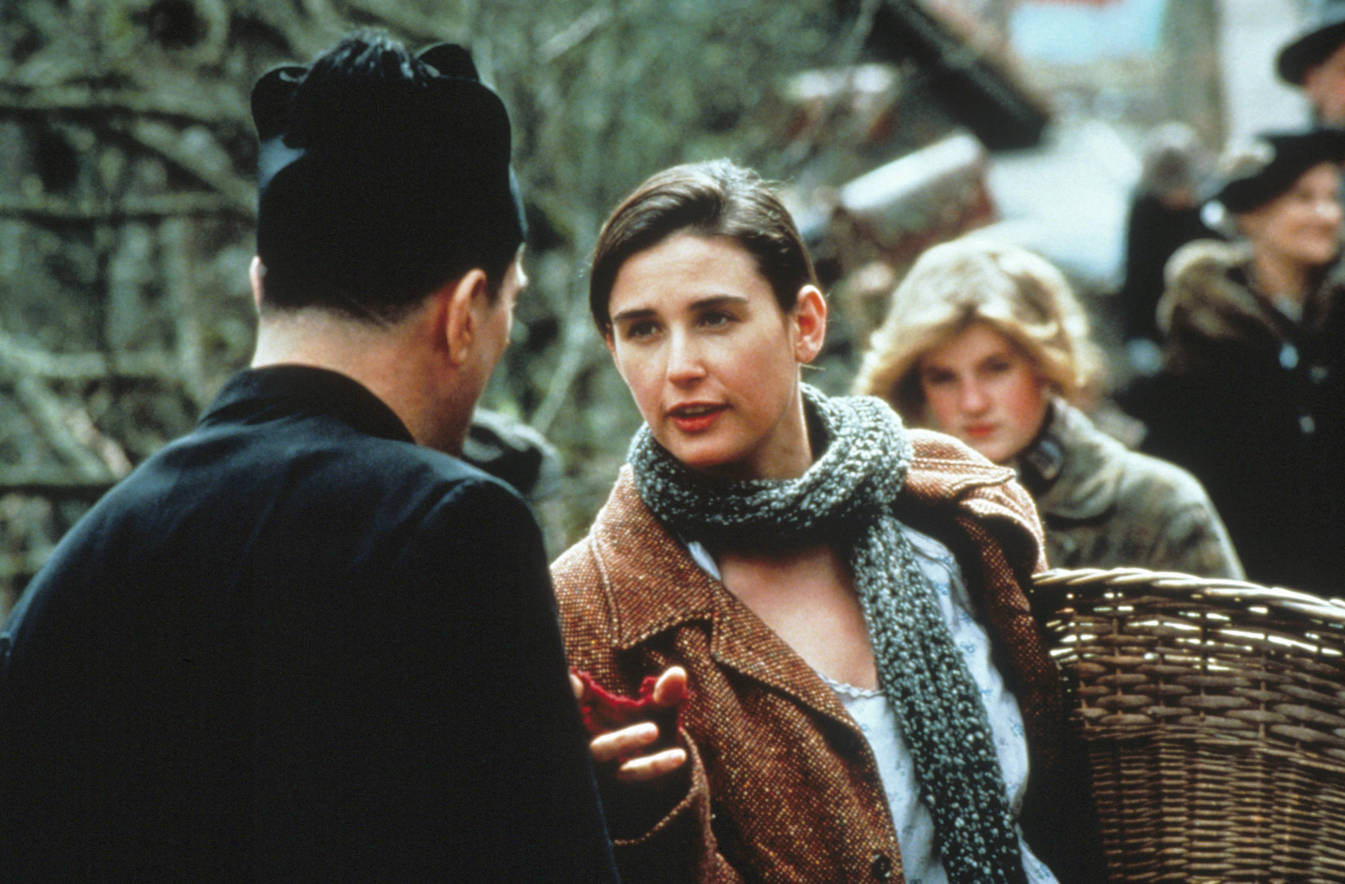 WE'RE NO ANGELS, Robert De Niro (back to camera), Demi Moore (scarf), 1989, © Paramount/courtesy Everett Collection