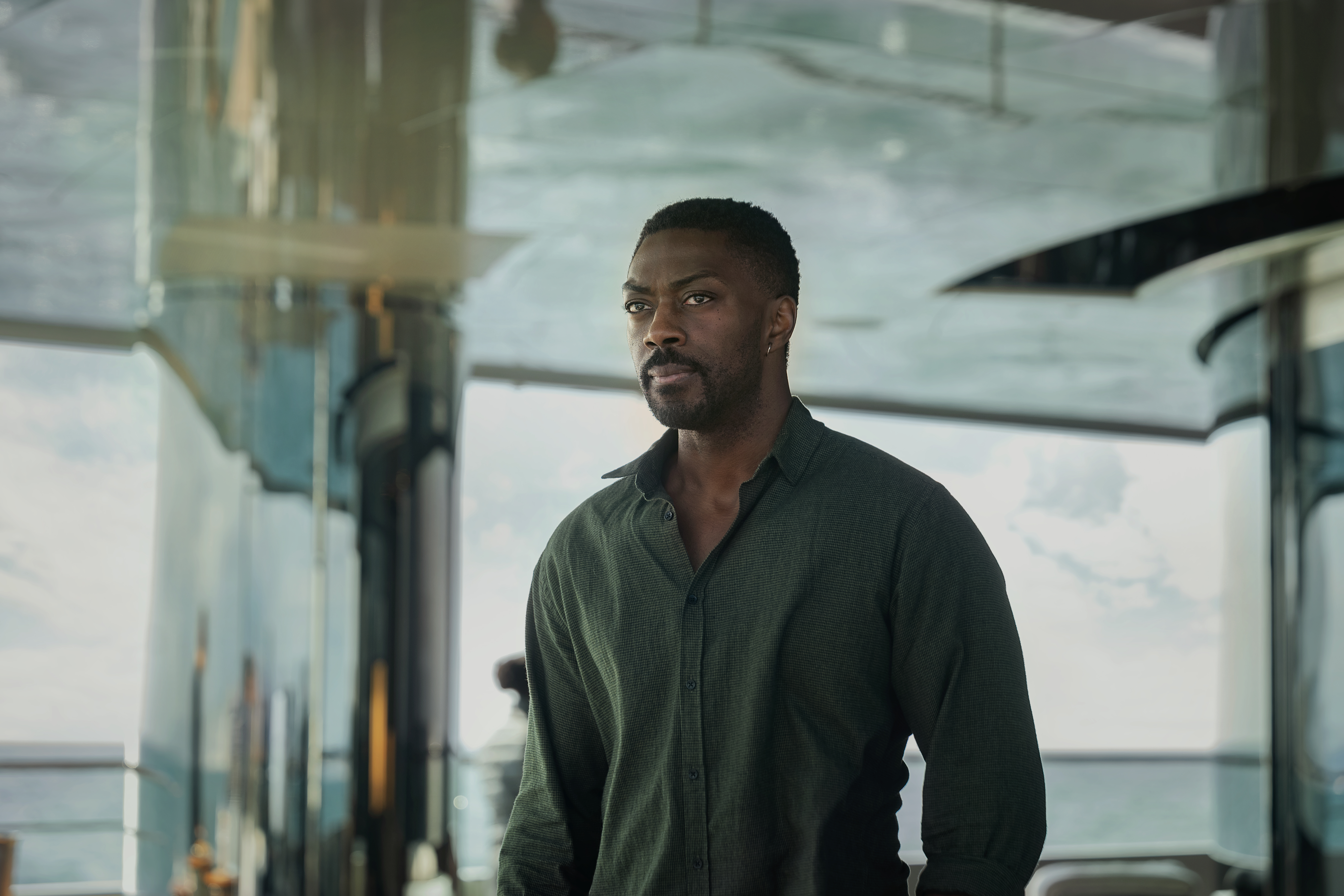 The Woman in Cabin 10. David Ajala as Ben in The Woman in Cabin 10. Cr. Parisa Taghizadeh/Netflix © 2025