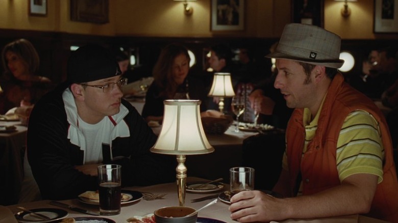 Eminem and George Simmons talk over a restaurant table in "Funny People" (2009)