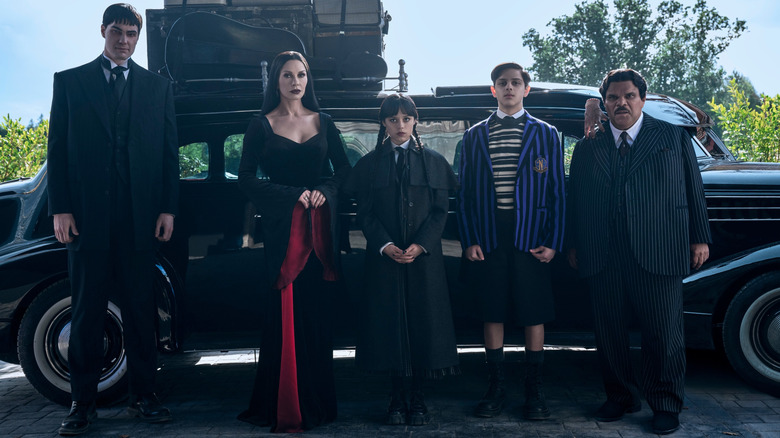The Addams family lined up outside their car on "Wednesday" Season 2 (2025)
