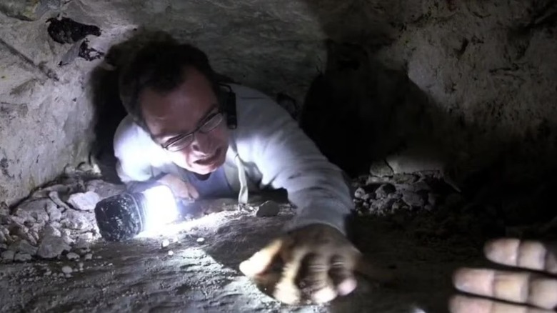 Gray Parker reaches for a hand while trapped in a tunnel in "Final Prayer" (2013)