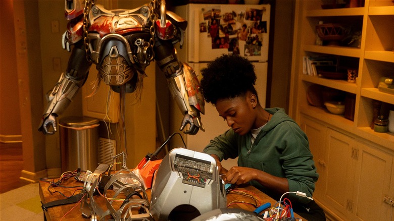 Riri Williams working on robotics in her kitchen in "Ironheart" (2025)