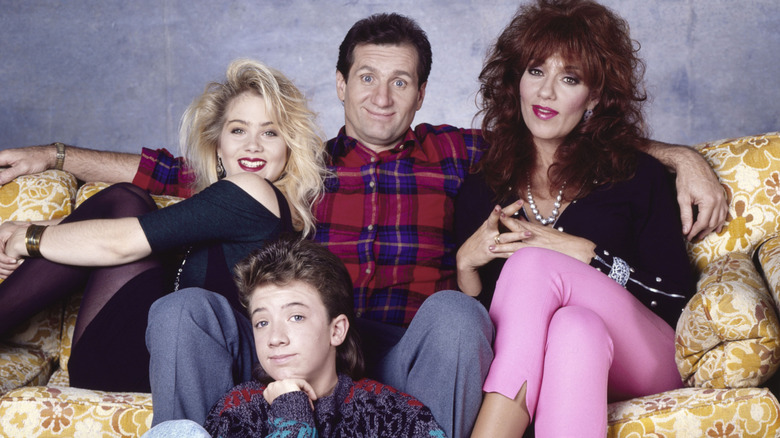 The Bundy family from "Married... with Children" poses for a photo