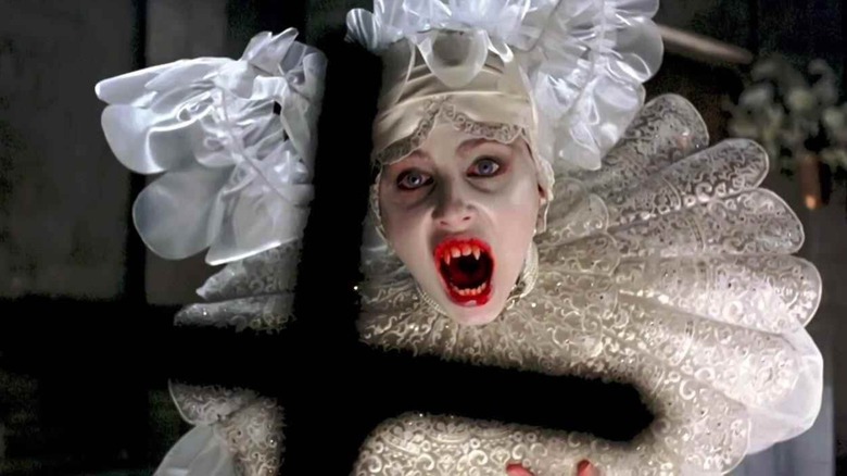 A turned Lucy shying from a cross in "Bram Stoker's Dracula"