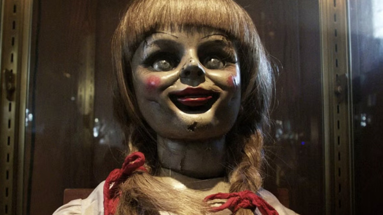 Annabelle grins hideously in "Annabelle Comes Home" (2019)