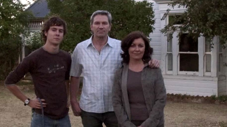 The Palmers stand in front of their house in "Lake Mungo" (2008)