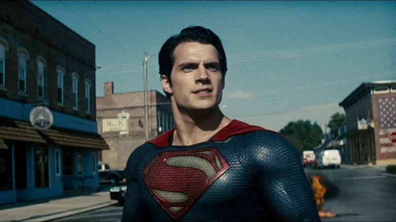 Superman stands in the street and looks up angrily in Man of Steel (2013)