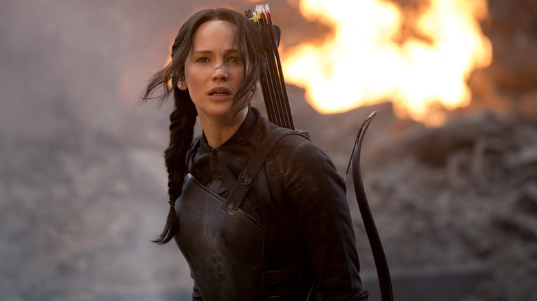 Katniss in front of an explosion in Mockingjay