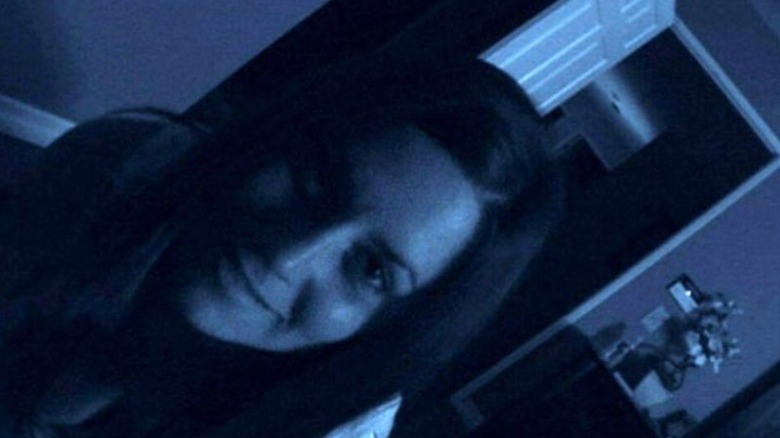 The possessed Katie crawls towards the unseen camera in "Paranormal Activity" (2009)