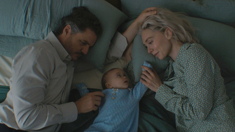 Reed and Sue rest on bed with Franklin in "The Fantastic Four: First Steps" (2025)