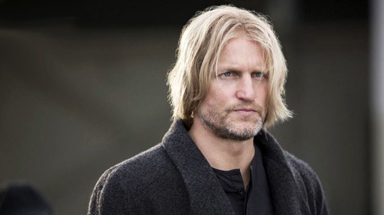 Haymitch in a sweater looking into the distance in The Hunger Games: Mockingjay
