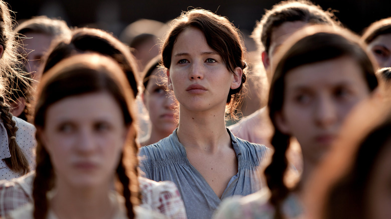 Katniss in the crowd at the reaping in The Hunger Games