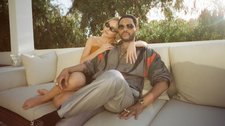 Jocelyn and Tedros sitting on a couch in "The Idol."