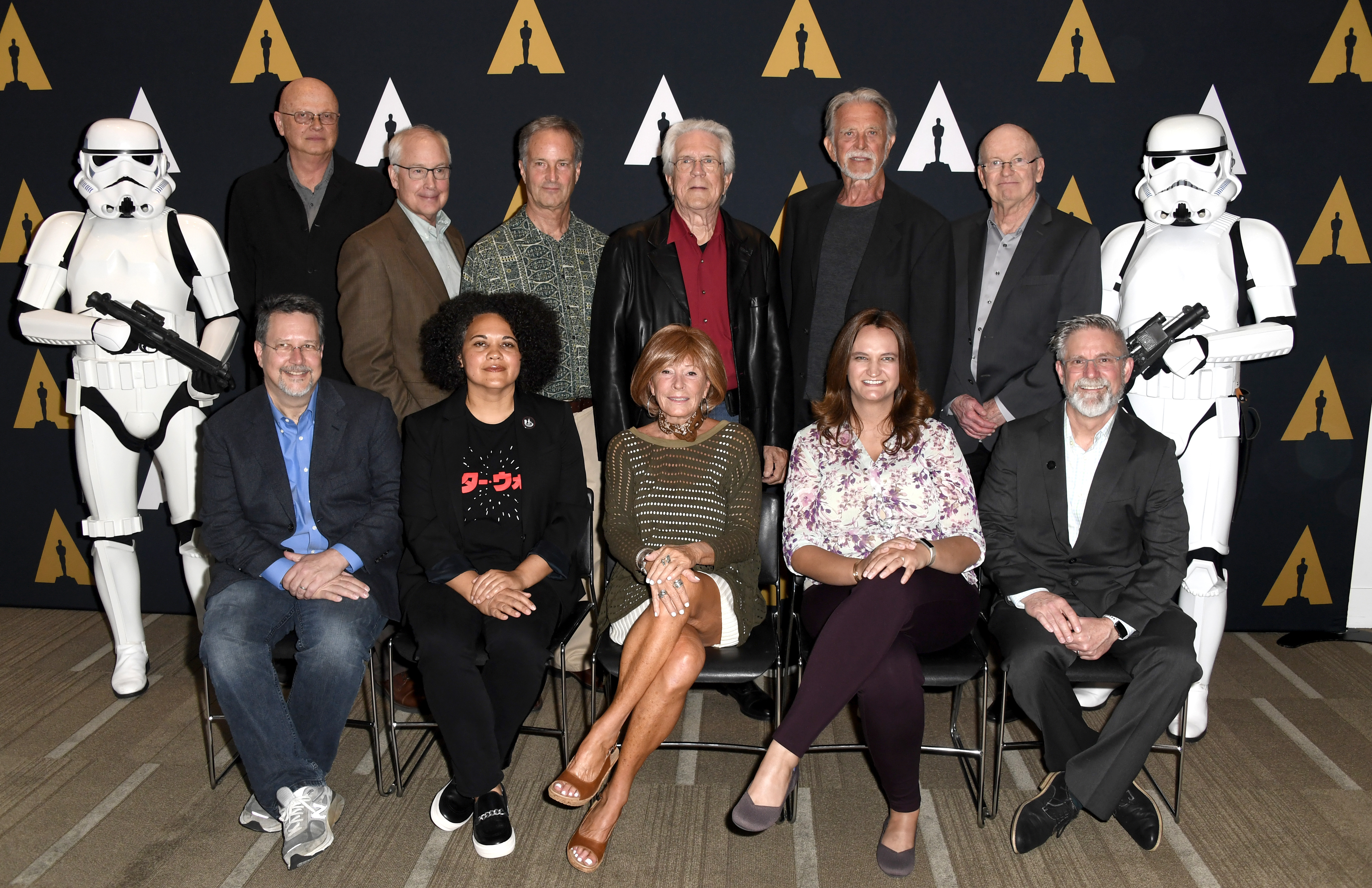 BEVERLY HILLS, CALIFORNIA - JUNE 27: Back Row (L-R) Denis Muren, Ben Burtt, Bruce Nicholson, Richard Edlund, John Dykstra, Harrison Ellenshaw Front (L-R) John Knoll, Kiri Hart, Marcia Lucas, Rachel Rose, Bill George, The Academy Of Motion Picture Arts And Sciences Hosts Galactic Innovations: Star Wars And Rogue One Photo Call at Samuel Goldwyn Theater on June 27, 2019 in Beverly Hills, California. (Photo by Frazer Harrison/Getty Images)