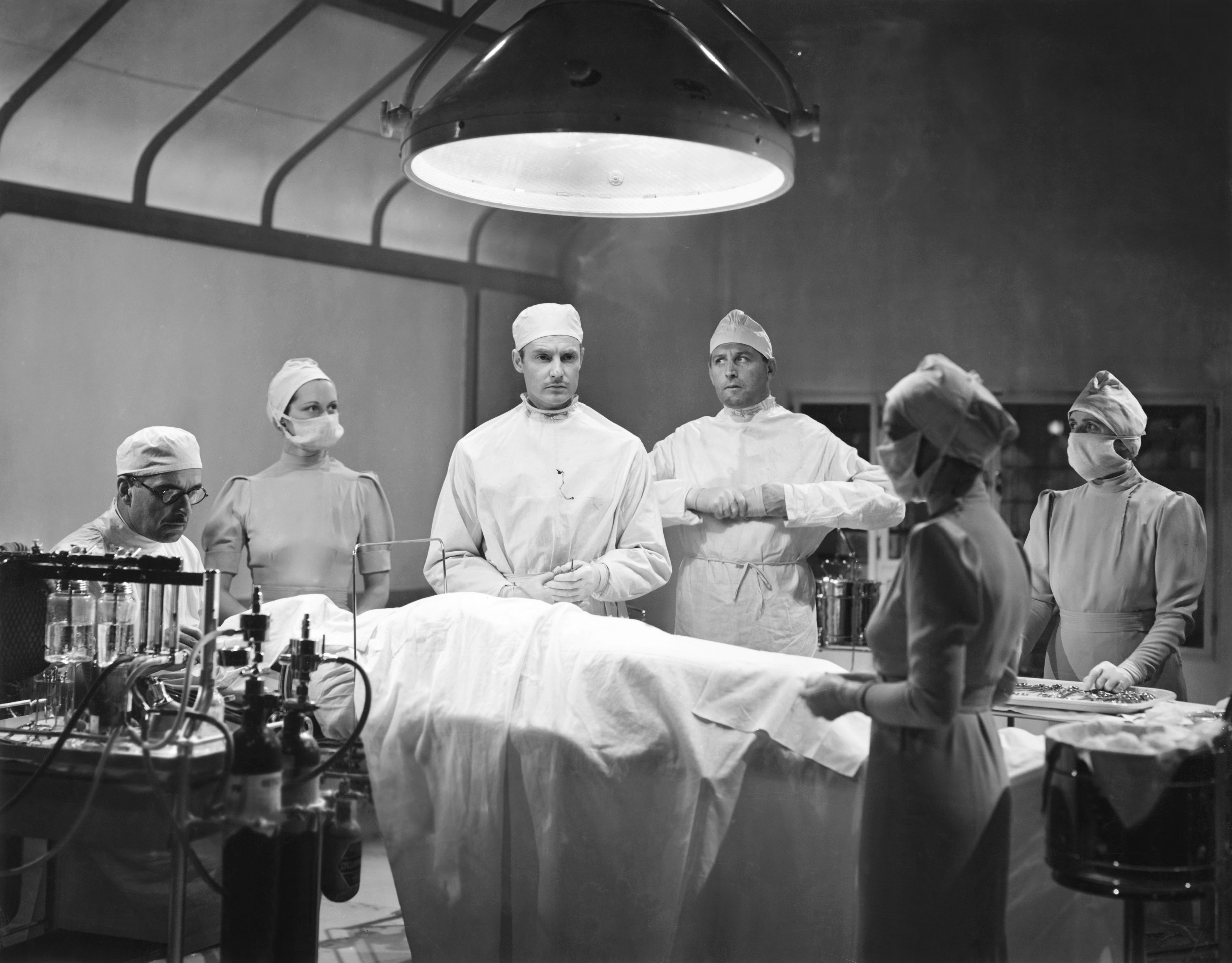 THE CITADEL, center from left: Robert Donat, Cecil Parker, 1938