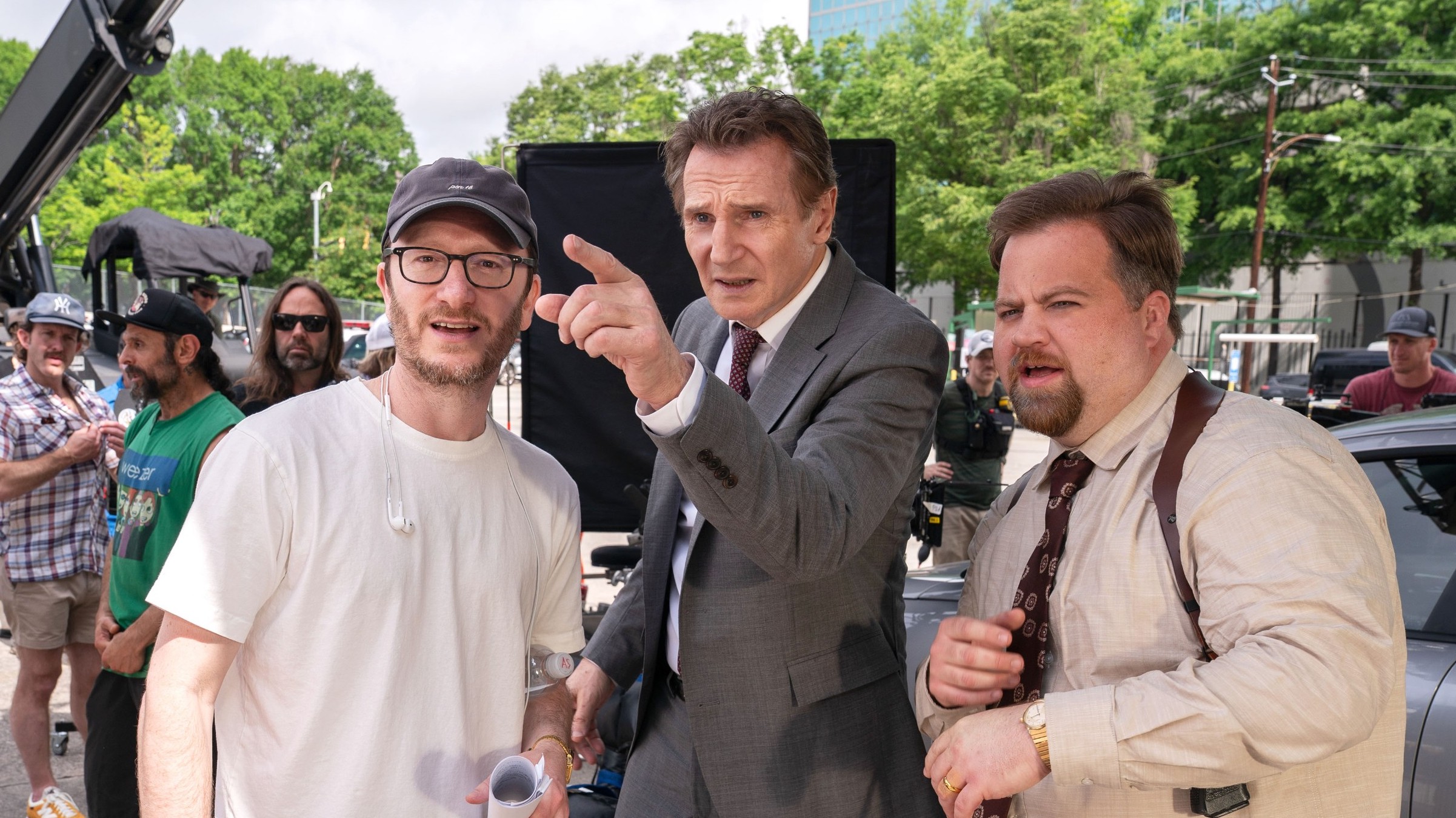Akiva Schaffer, Liam Neeson, Paul Walter Hauser on the 'Naked Gun' set