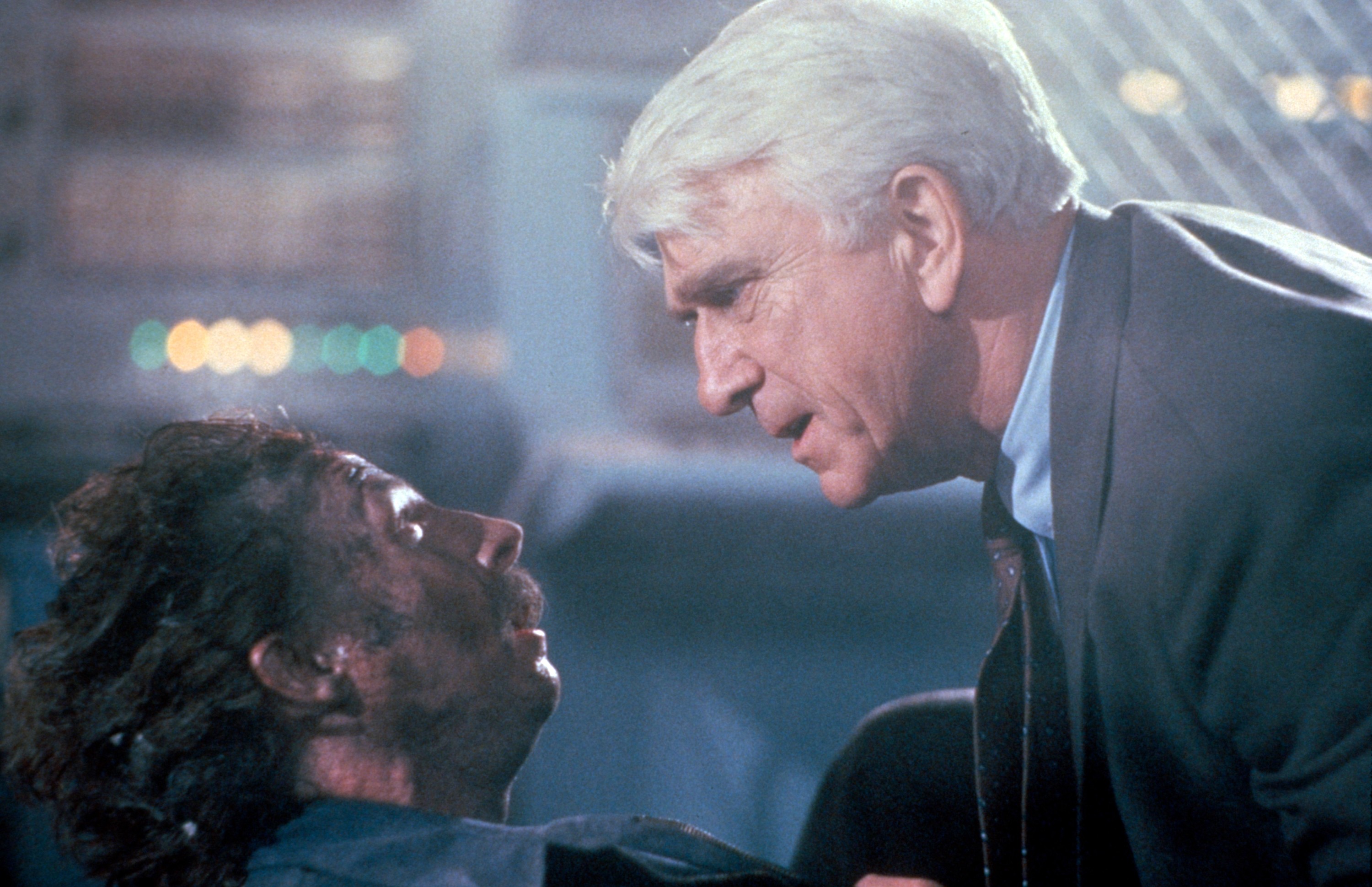 NAKED GUN 2 1/2: THE SMELL OF FEAR, From left: Anthony James , Leslie Nielsen, 1991. © Paramount/Courtesy Everett Collection