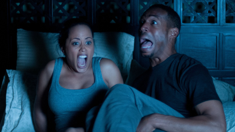 Keisha and Malcolm freak out in "A Haunted House"