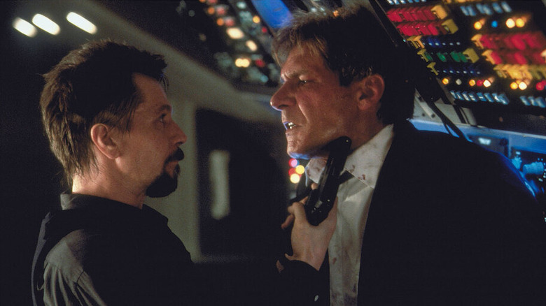 Korshunov holds a gun to President Marshall's neck in "Air Force One" (1997)